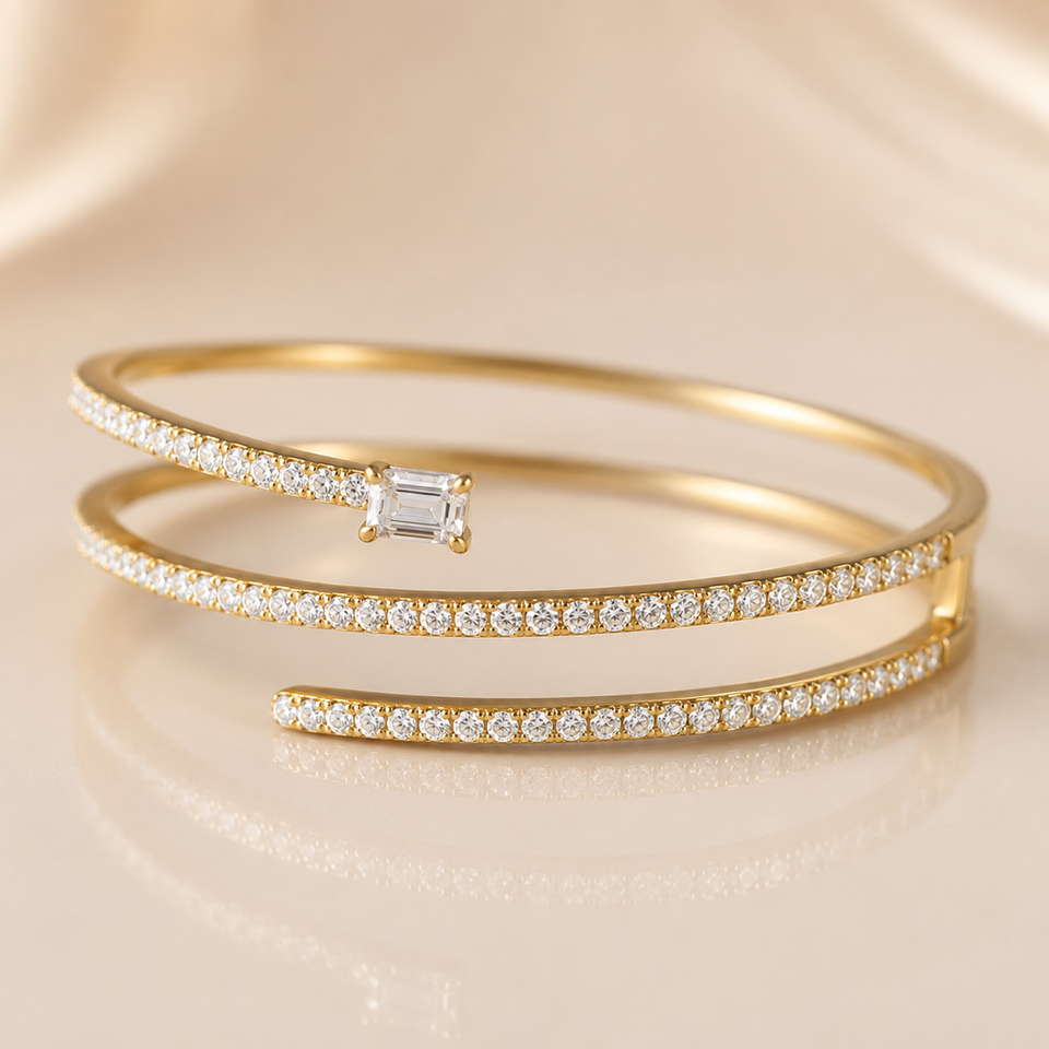 Gold bangle bracelet with sparkling details